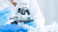 Scientist analyze biochemical samples in advanced scientific laboratory. Medical professional use microscope look microbiologica