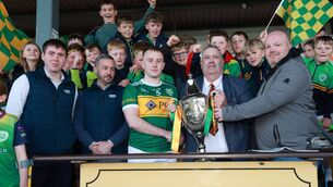 <p>Ger McNally, Sports Editor of The Carlow Nationalist and Carlow GAA Chairman John McDonald present the Nationalist Cup to Rathvilly captain Colin Byrne after last Sunday's win over Old Leighlin in this year's final. Pic: Pat Ahern</p>
