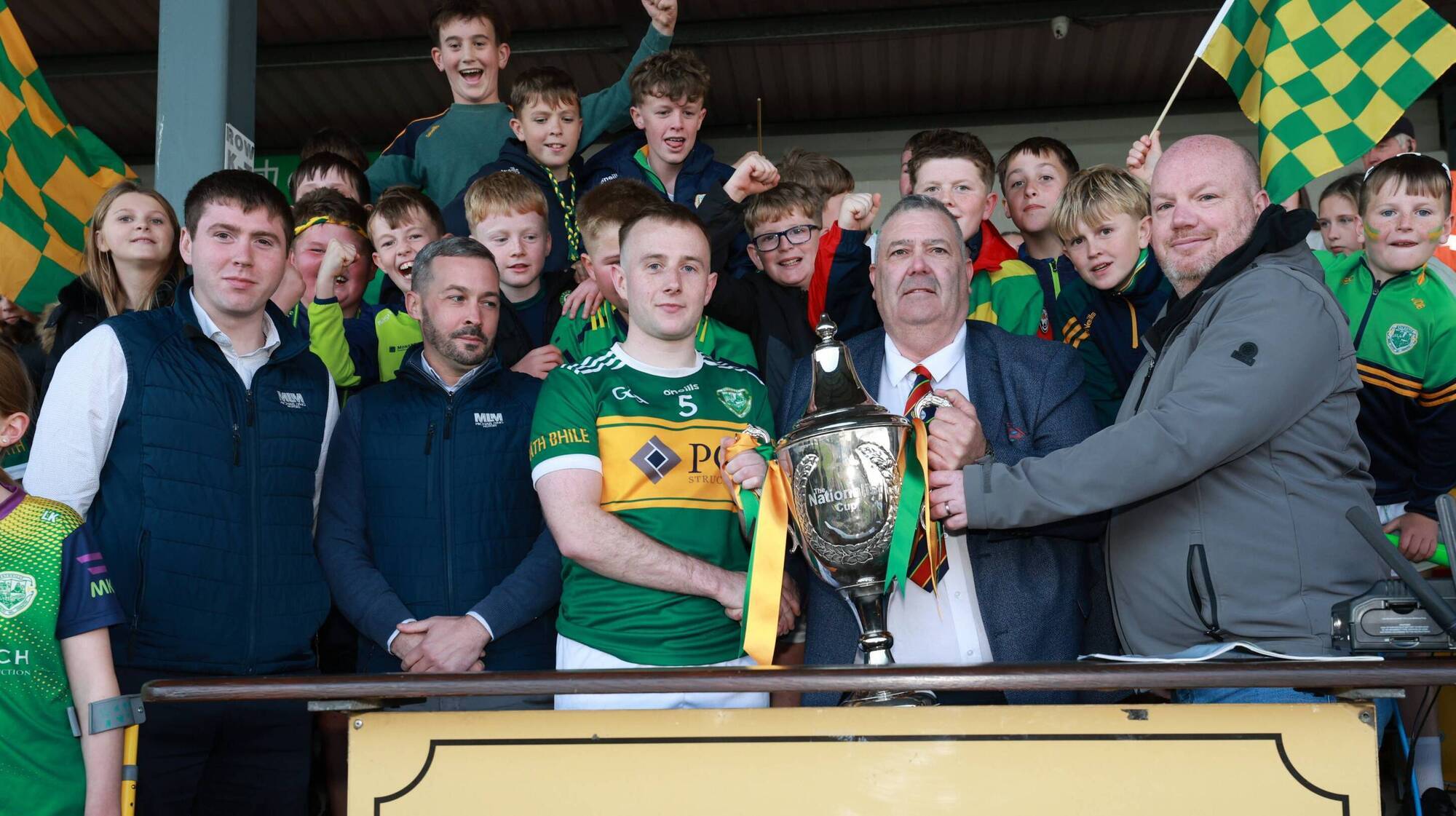 Ger McNally, Sports Editor of The Carlow Nationalist and Carlow GAA Chairman John McDonald present the Nationalist Cup to Rathvilly captain Colin Byrne after last Sunday's win over Old Leighlin in this year's final. Pic: Pat Ahern