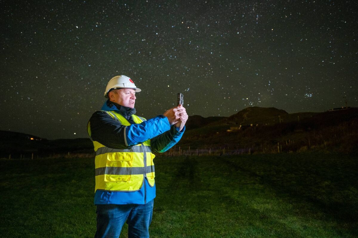 Vodafone Ireland engineer Robert Kennedy prepares to make history with Ireland’s first mobile video phone call via satellite, using a standard smartphone on Clare Island, off the coast of Co Mayo. Vodafone Ireland engineer Robert Kennedy prepares to make history with Ireland’s first mobile video phone call via satellite, using a standard smartphone on Clare Island, off the coast of Co Mayo.