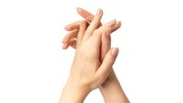 iStock-2290898552.jpg Close-up of elegant female hands with manicured nails forming a graceful crossed-hand gesture, isolated on a clean white backgro