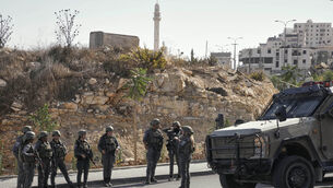 The move followed an attack carried out by Palestinian gunmen at a junction near Hebron in the occupied West Bank (AP) The move followed an attack carried out by Palestinian gunmen at a junction near Hebron in the occupied West Bank (AP)
