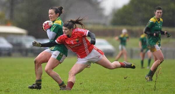 Anna Galvin, Kerry, and Marie Ambrose, Cork, in action amid torrential rain and high winds at Brosna. Photo: Domnick Walsh
