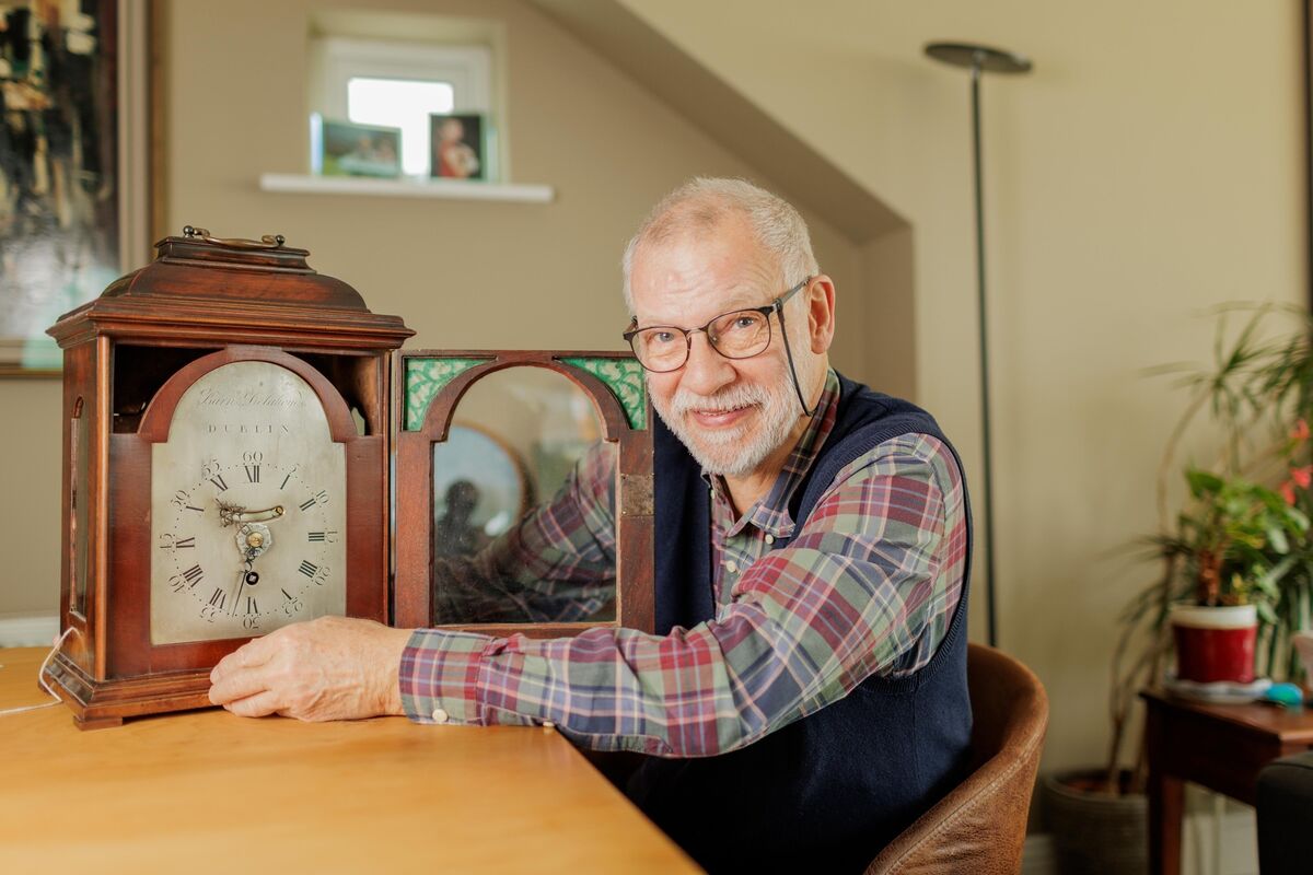 Killian Robinson, putting one of his clocks back one hour as summertime ends, at his home in Rosses Point Sligo. Picture: James Connolly