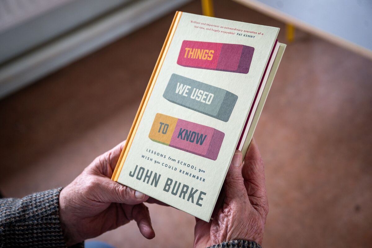 Author and retired teacher John Burke holds his new book, 'Things We Used to Know'. Picture: Chani Anderson