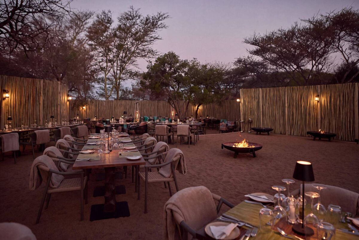Dining at the traditional boma enclosure in Club Med Vikela Safari Lodge in South Africa Dining at the traditional boma enclosure in Club Med Vikela Safari Lodge in South Africa