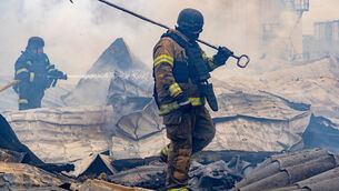 <p>Rescuers work on the roof of a damaged building following Russia’s air attack in Kharkiv, Ukraine (Andrii Marienko/AP)</p> <p>Rescuers work on the roof of a damaged building following Russia’s air attack in Kharkiv, Ukraine (Andrii Marienko/AP)</p>