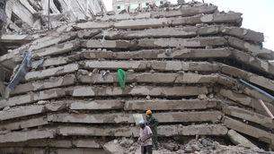 Security forces and civil defence work after a multi-story building collapsed in Nairobi, Kenya (Brian Inganga/AP) Security forces and civil defence work after a multi-story building collapsed in Nairobi, Kenya (Brian Inganga/AP)