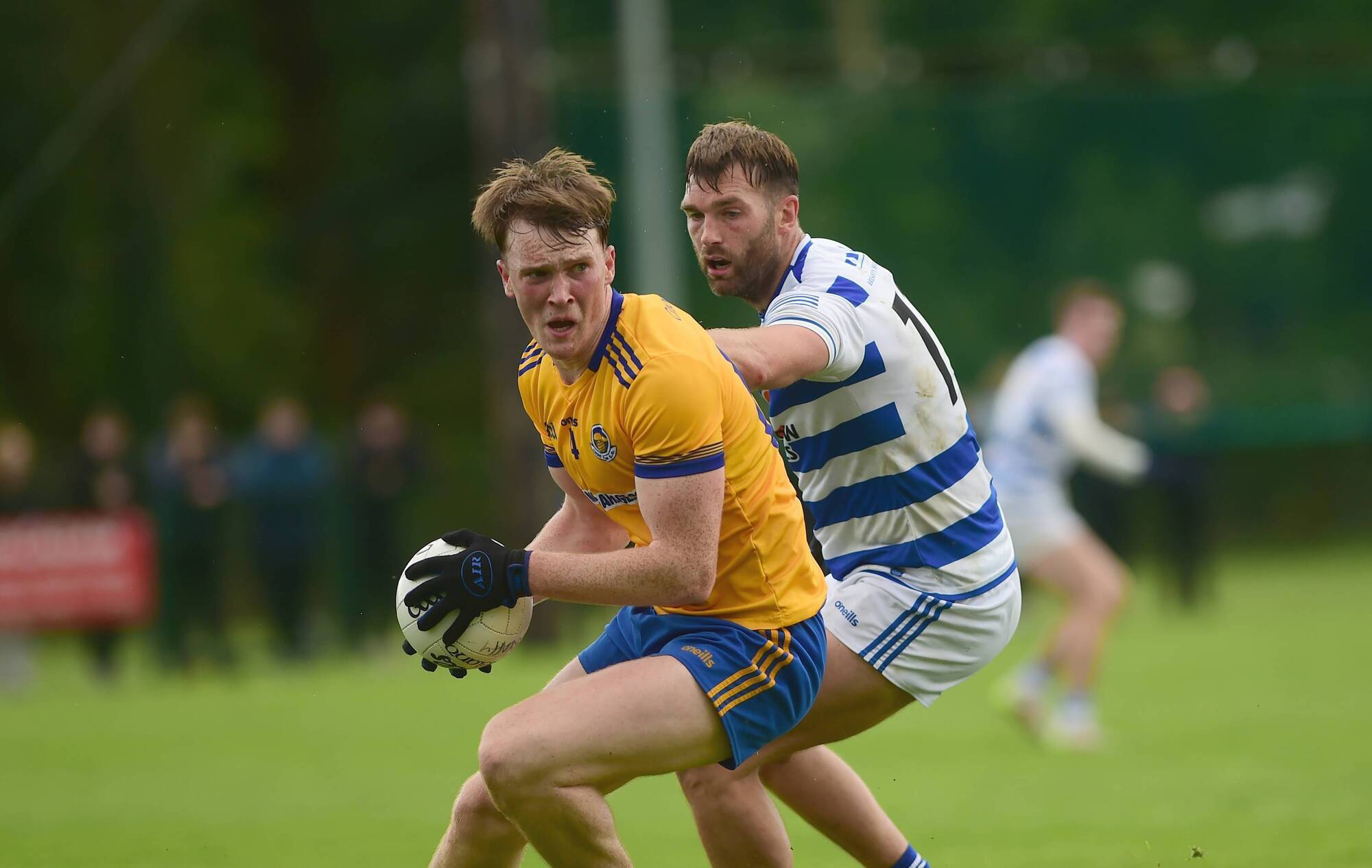 Knockmore's Oliver Armstrong turns past Breaffy's Aidan O'Shea in Kiltimagh. Pic: Conor McKeown