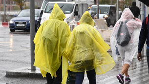 <p>Braving the elements during a heavy rain shower in Cork. File picture: Denis Minihane.</p> <p>Braving the elements during a heavy rain shower in Cork. File picture: Denis Minihane.</p>