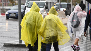 <p>Braving the elements during a heavy rain shower in Cork. File picture: Denis Minihane.</p> <p>Braving the elements during a heavy rain shower in Cork. File picture: Denis Minihane.</p>