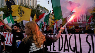 Members of right-wing student groups march through the streets of Rome on Saturday (Gregorio Borgia/AP) Members of right-wing student groups march through the streets of Rome on Saturday (Gregorio Borgia/AP)