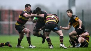 <p>SODDEN SLOG: Brian Barry of Malahide is tackled by Matthew O'Hara, left, and Matthew Early of Sligo during the Energia Men's All-Ireland League Division 2B match between Malahide and Sligo at Estuary Road in Malahide, Dublin. Photo by Ben McShane/Sportsfile</p>