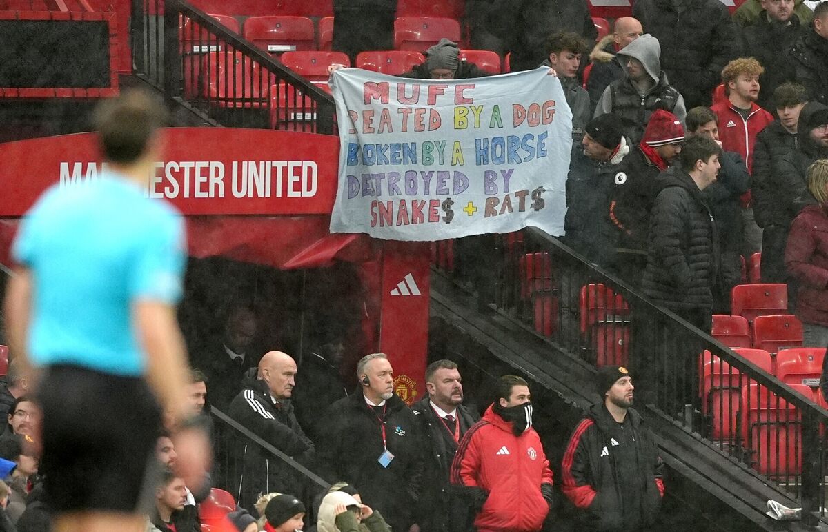 Manchester United fans holding a banner in protest to the club owners during the Premier League match at Old Trafford. Pic: Martin Rickett/Press Association. Manchester United fans holding a banner in protest to the club owners during the Premier League match at Old Trafford. Pic: Martin Rickett/Press Association.