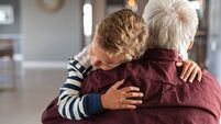 Attached child hugging his grandfather