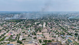 Smoke rises from a residential neighbourhood in the Russian-occupied city of Oleshky in Ukraine (Ukrainian 34th Separate Marine Brigade Borysfen via AP) Smoke rises from a residential neighbourhood in the Russian-occupied city of Oleshky in Ukraine (Ukrainian 34th Separate Marine Brigade Borysfen via AP)