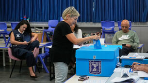 <p>A woman casting her ballot at a polling station during Israel's general election in Jerusalem. (AP Photo/Ohad Zwigenberg)</p> <p>A woman casting her ballot at a polling station during Israel's general election in Jerusalem. (AP Photo/Ohad Zwigenberg)</p>