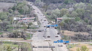 Destroyed cars are seen on a road from the Russian-occupied city of Oleshky in Ukraine (Ukrainian 34th Separate Marine Brigade ‘Borysfen’ via AP)