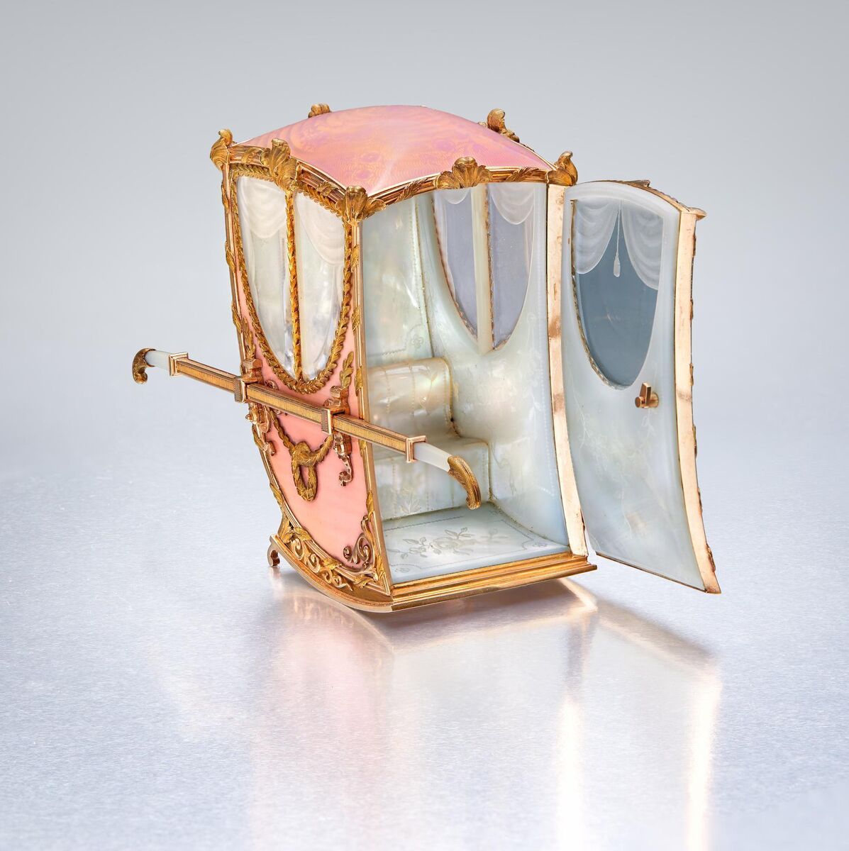 A Fabergé varicolour gold, rock crystal, mother of pearl and enamel sedan chair at Sotheby's.