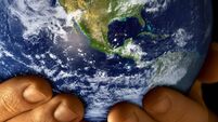 Man with planet earth in hands