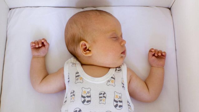 <p>A healthy baby sleeping in a Finnish baby box that its government gives to parents in Finland. Many SIDS deaths may be associated with modifiable risk factors, including infant sleep position, sleep environment, and exposure to tobacco smoke. File Picture: Alamy/PA</p>