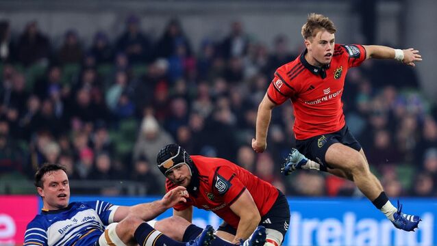 <p>FLYING START: Munster's Charlie O’Shea leaps over Gavin Coombes and Leinster's James Ryan. Pic: Ben Brady/Inpho</p>