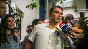 <p>Bolsonaro, the son of the jailed former Brazilian president Jair Bolsonaro, boarded the jet with his wife and two daughters at about 11.30pm. (Photo by Lucas Neves/NurPhoto via Getty Images)</p> <p>Bolsonaro, the son of the jailed former Brazilian president Jair Bolsonaro, boarded the jet with his wife and two daughters at about 11.30pm. (Photo by Lucas Neves/NurPhoto via Getty Images)</p>