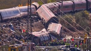 <p>Emergency services work at the scene of a collision between two trains in Urda, Spain (Manu Fernandez/AP)</p>