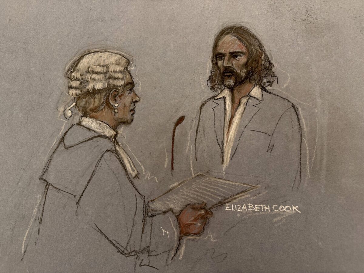 Court artist sketch of Riel Karmy-Jones cross-examining Russell Brand in the dock at Southwark Crown Court. Picture: Elizabeth Cook/PA