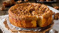 Piece of apple pie with walnut and sugar glaze