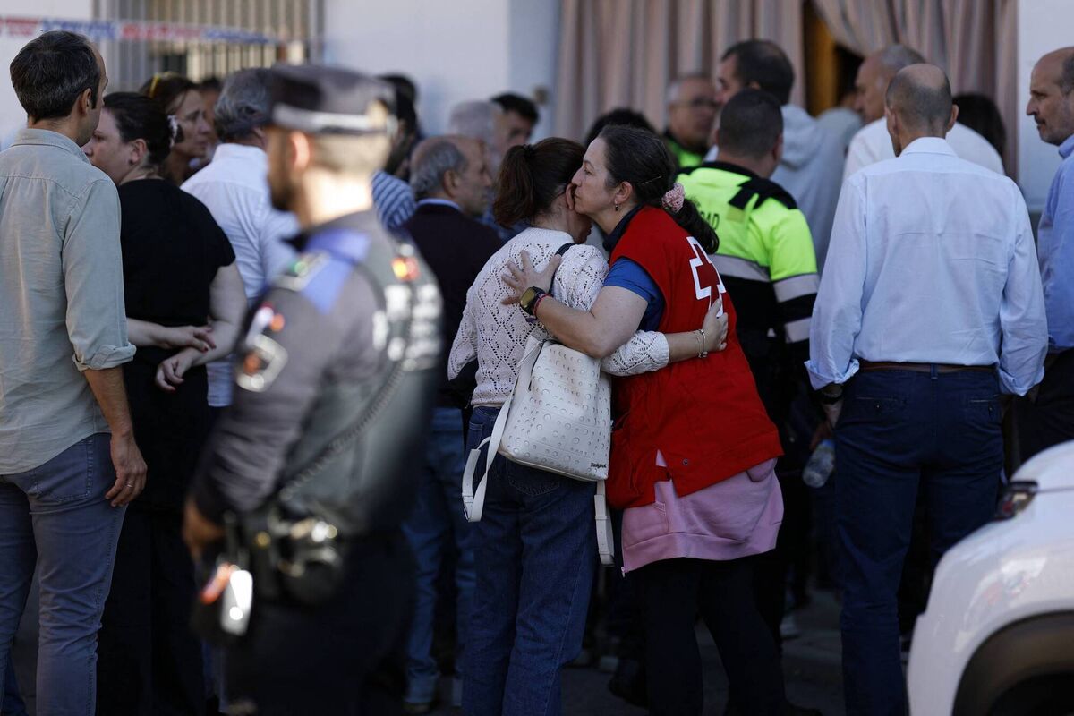 A Red Cross volunteer conforts a outside a support center for relatives of missing victims in Urda, following the train crash between a high-speed Renfe AVE train and an Iryo train around 150 km south of Madrid between Urda and Los Yebenes in the province of Toledo, on October 28, 2026. Picture; Oscar DEL POZO / AFP via Getty Images