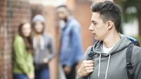Insecure or intimidated teen iStock-515202215.jpg Teenage Boy Feeling Intimidated As He Walks Home