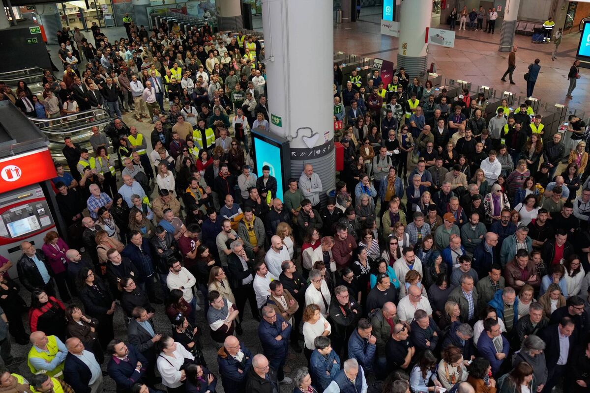 People observe a minute of silence in memory of the victims of a train collision at Atocha train station in Madrid yesterday. Picture: Bernat Armangue/AP People observe a minute of silence in memory of the victims of a train collision at Atocha train station in Madrid yesterday. Picture: Bernat Armangue/AP