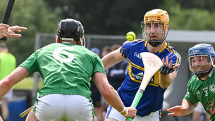 <p>STILL STANDING: Carrigtwohill's Liam O'Sullivan gets his pass away past Killeagh's Ben Walsh during their SHL clash in June. Pic: David Keane.</p>
