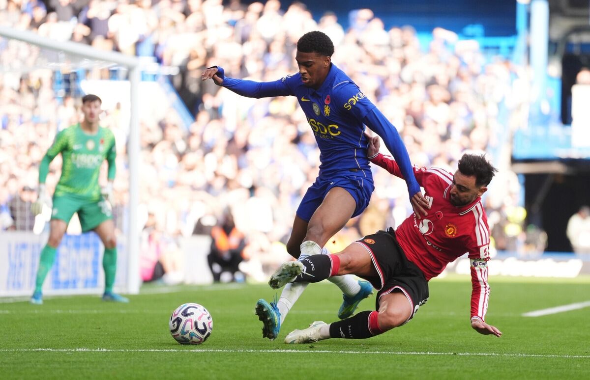 CAPTAIN POINTLESS: Chelsea's Josh Acheampong and Manchester United's Bruno Fernandes (right) battle for the ball during the Premier League match at Stamford Bridge, London. CAPTAIN POINTLESS: Chelsea's Josh Acheampong and Manchester United's Bruno Fernandes (right) battle for the ball during the Premier League match at Stamford Bridge, London.