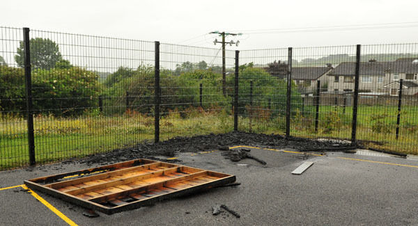 The scene this morning, showing the destroyed shed. Picture: Des Barry