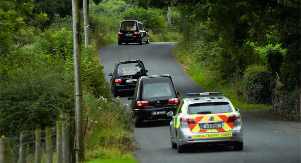 Hearses carry the remains from the scene at Cavan