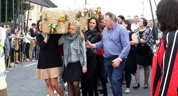 The wicker coffin bearing the remains of Ailish Sheehan is carried by friends for funeral mass in St. Josheph's Church Kildimo, Co Limerick this afternoon. Pic: Press 22