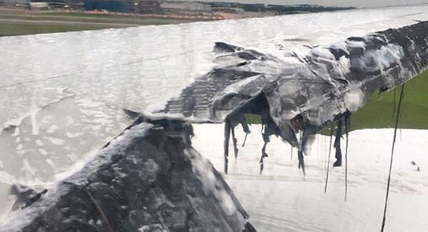 Roughly the same view of the plane's wing, after the fire. Picture: AP Roughly the same view of the plane's wing, after the fire. Picture: AP