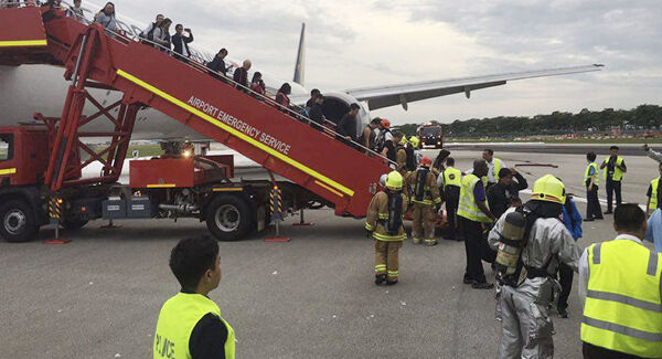 Passengers disembark the plane. Picture: AP Passengers disembark the plane. Picture: AP