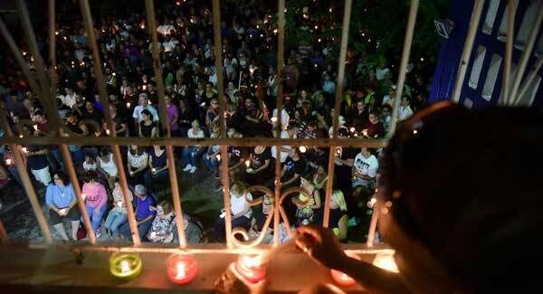 Residents carry out a vigil to honor the memory of the Puerto Ricans that died in the mass shooting at the Pulse nightclub in Orlando, at the Hato Rey LGBTT Community Center in San Juan, Puerto Rico. Pic: AP Residents carry out a vigil to honor the memory of the Puerto Ricans that died in the mass shooting at the Pulse nightclub in Orlando, at the Hato Rey LGBTT Community Center in San Juan, Puerto Rico. Pic: AP