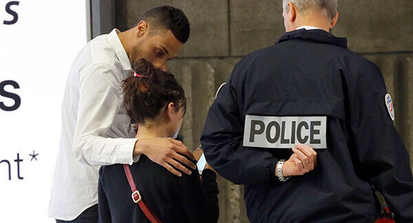 A relative of the victims of the EgyptAir flight 804 is escorted at Charles de Gaulle Airport outside of Paris. Pic: AP