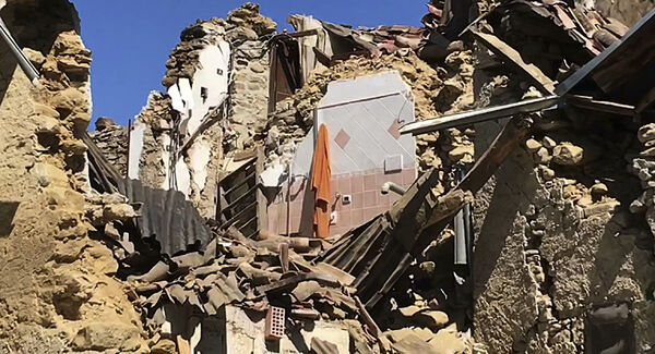 The remains of a collapsed house Villa San Lorenzo a Flaviano, near Amatrice, central Italy, today. Pic: AP
