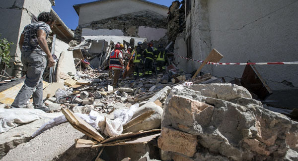 Firefighters search through rubble following an earthquake in Accumoli. Firefighters search through rubble following an earthquake in Accumoli.