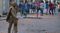 At least 25 killed in India during rebel leader death protests