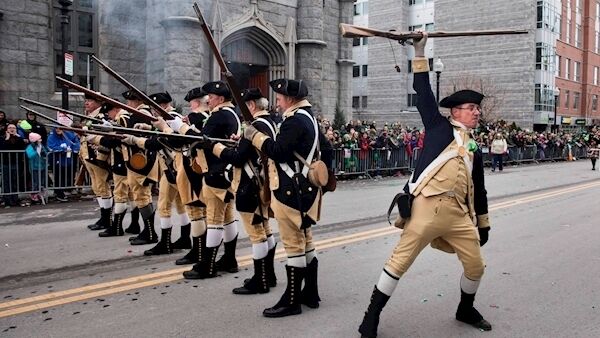 American Revolutionary War re-enactors fire musket blanks during a St Patrick’s Day parade in Boston. This year’s has been cancelled.
