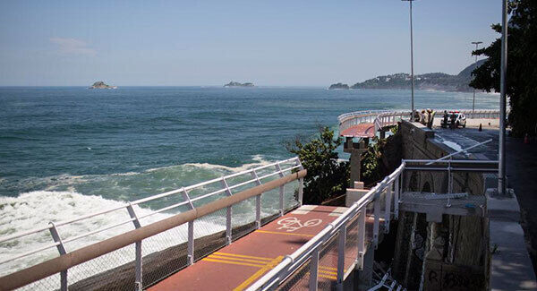 A bike lane is missing a section after it collapsed onto the beach below in Rio de Janeiro. (AP photo) A bike lane is missing a section after it collapsed onto the beach below in Rio de Janeiro. (AP photo)