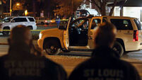 Texas manhunt under way after police officer shot dead