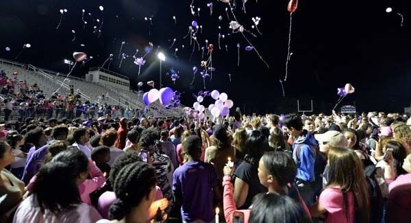 Classmates of Trinity Gay release balloons in her favorite colors in her memory at Lafayette High School, yesterday. Pic: AP