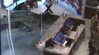 Watch this car burst through the front room of a Chicago salon